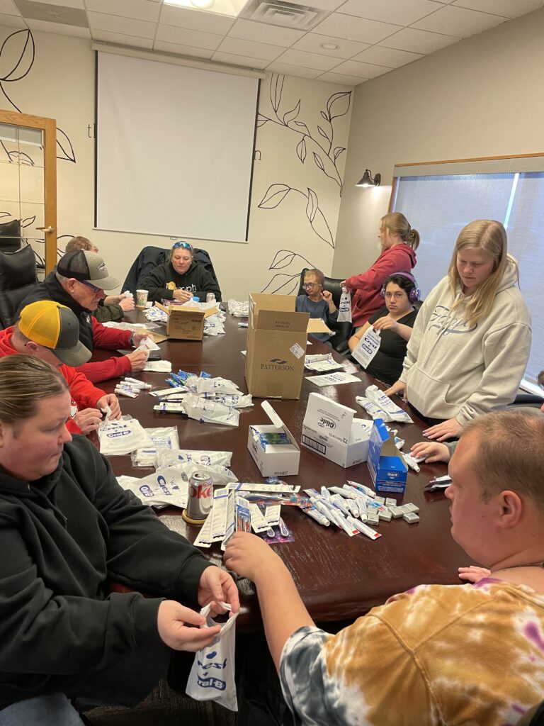 Packing dental supplies at Triumph, Inc - Jamestown, ND
