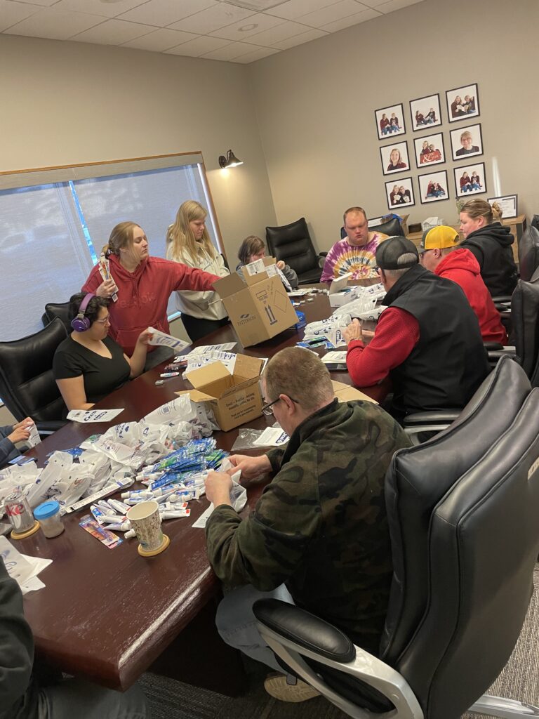Packing dental supplies at Triumph, Inc - Jamestown, ND