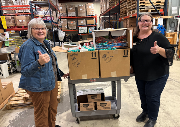 Giving donations to the food pantry! at Emergency Food Pantry - Fargo, ND